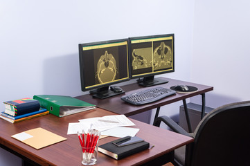 computed tomography / The doctor during the visual inspection the results of the tomography in...