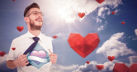 Composite image of geeky hipster opening shirt superhero style