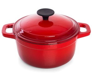 Red cast iron cooking pot with black handle, isolated on white b