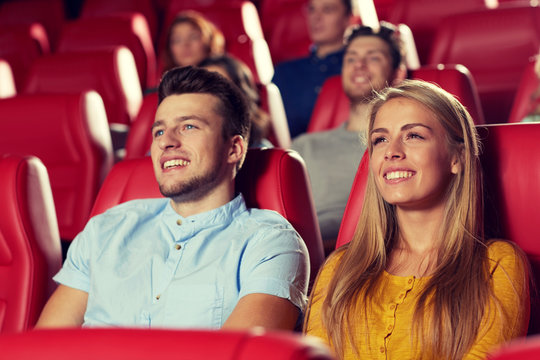 Happy Friends Watching Movie In Theater