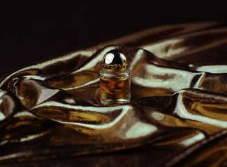 Bottle of perfume in gold tones