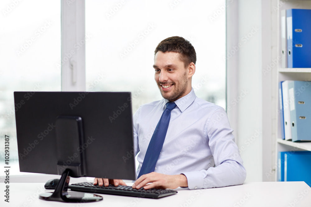 Sticker smiling young businessman with computer at office