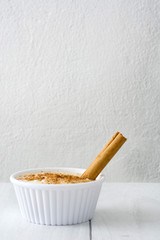 Rice pudding on white wood
