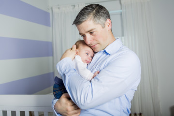 Father and baby at home together, bedtime