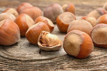 Hazelnuts on wooden background