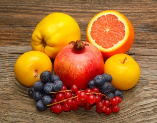 Fresh fruits on wooden background. Healthy eating, dieting, love fruits.