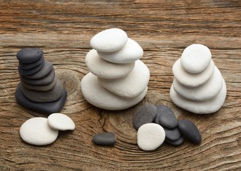 Stack of zen stones over wooden background