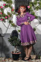 young redhead girl on a retro vintage dress