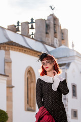 young redhead girl on a retro vintage dress