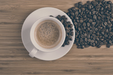 Coffee cup top view on wooden table background