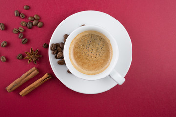 Coffee cup and coffee beans on table