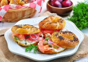 homemade bagel with smoked salmon, cream cheese, capers and onions