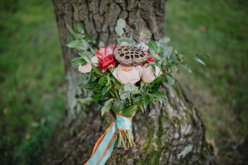 bridal bouquet style Bohemian on the green grass on a background