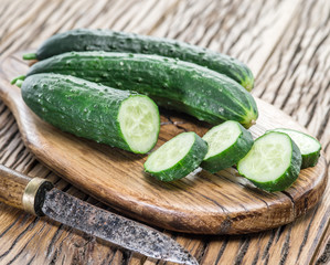 Cucumbers on the wooden table.