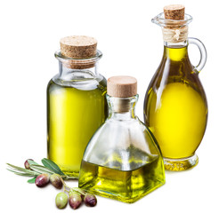 Olive oil and berries on the wooden table.