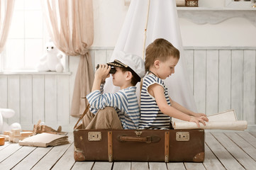 Boys in the image of sailors playing in her room