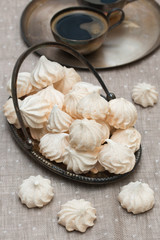 Meringue on the metal plate. Vintage style.