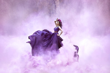 Lady in a luxury lush purple dress swirls in the smoke,fantastic shot,fairytale princess is walking in the autumn forest,fashionable toning,creative computer colors