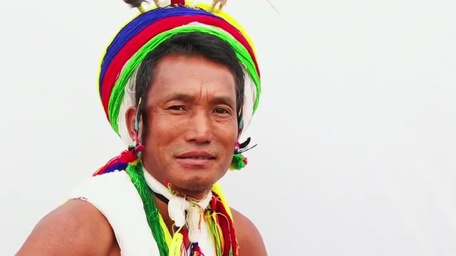 Locked-on shot of a Naga tribesman in traditional outfit during Hornbill Festival, Kisama, Kohima, Nagaland, India