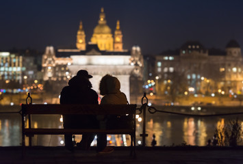 Fototapeta na wymiar Couple on bench in Budapest, Europe.