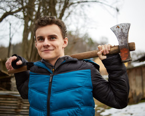 Teenager holding axes outdoor