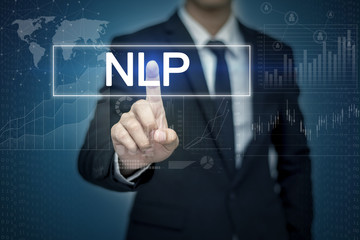Businessman hand touching NLP button on virtual screen