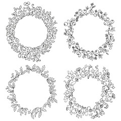 Set of round frames. Hand-drawn floral wreath with leaves and berries. Black and white vector illustration.