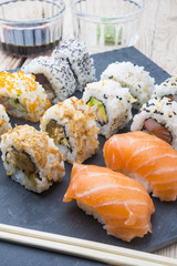 Sushi rolls on a slate plate