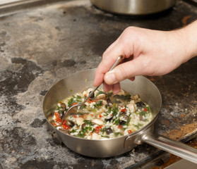 Chef is stirring risotto