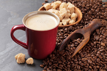 Coffee cup, beans and brown sugar