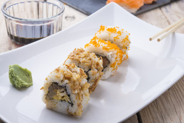 Salmon and caviar rolls served on a plate