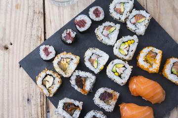 Sushi rolls on a slate plate