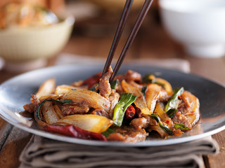 eating a plate of mongolian beef stir fry