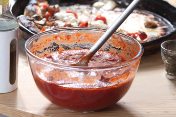 pizza and ingredients on the table