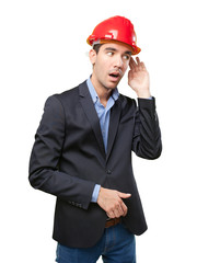 Astonished architect with hear gesture