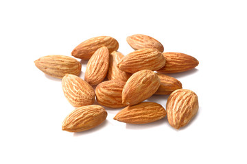 dried almond seeds on white