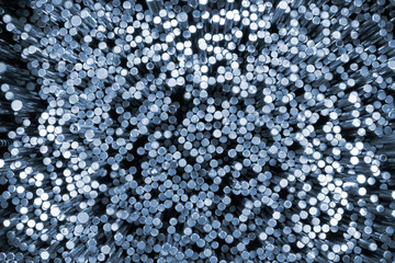 Shiny metal round bars. Blue tinted industrial background