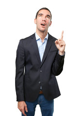 Astonished businessman pointing up