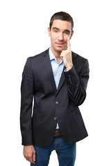 Confident businessman with observe gesture