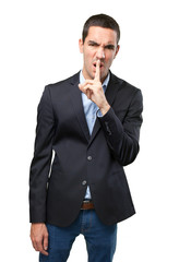 Upset businessman with silence gesture