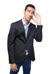 Worried businessman with hear gesture