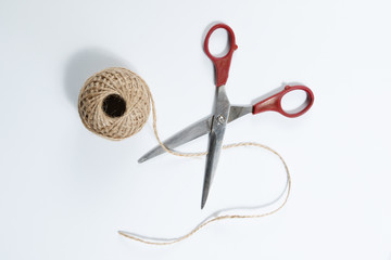 Scissors cut the  packthread