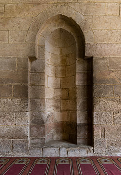 A stone wall with embedded niche