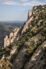 Fototapeta na wymiar View of the beautiful mountains of Montserrat where a famous benedictine abbey is located near Barcelona city, Spain.