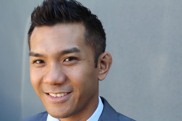 Horizontal portrait of a natural handsome classic Asian male with copy space on the right