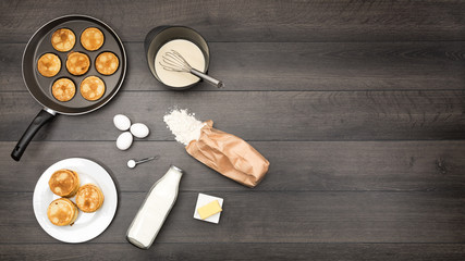 Small pancakes and its necessary ingredients on table, with copy space.