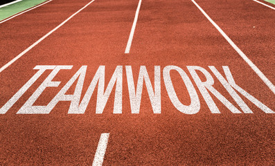 Teamwork written on running track