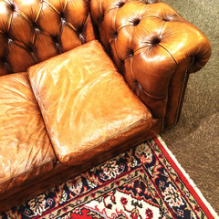 Luxurious leather sofa and ornamental rug