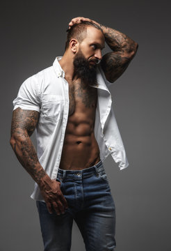 A man with tattooes on his arms