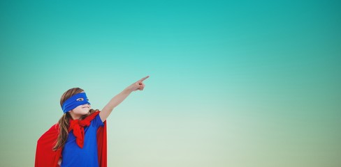 Composite image of masked girl pretending to be superhero © vectorfusionart